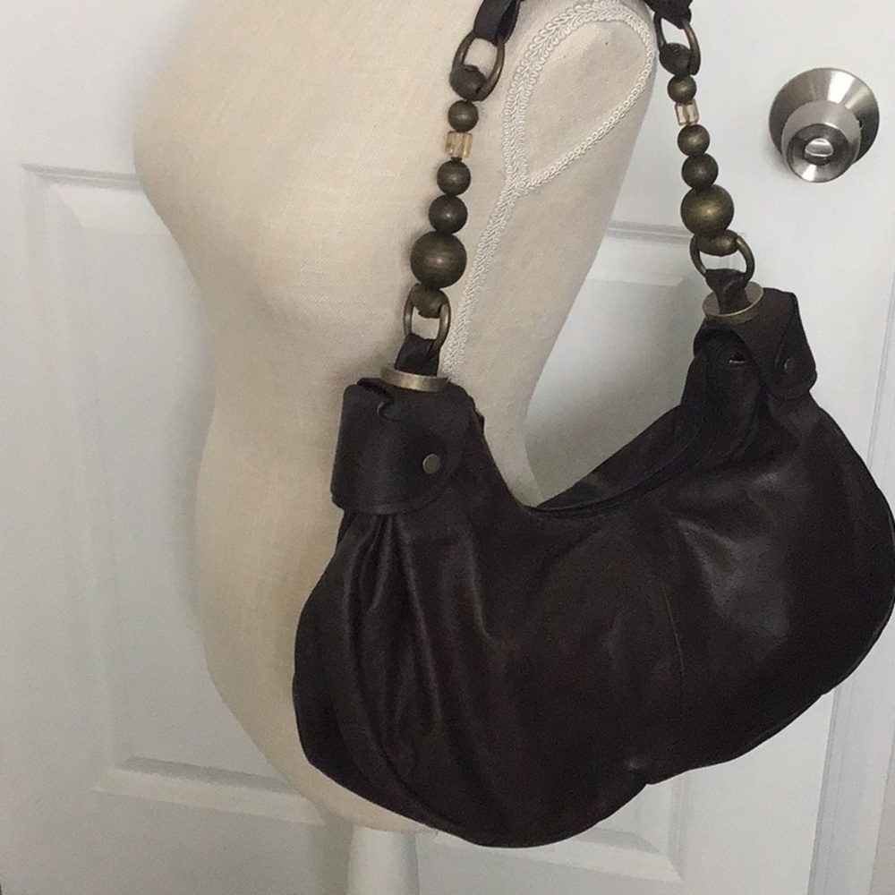 Large 16”X6” Brown leather handbag with bag pouch. New w/o tags.